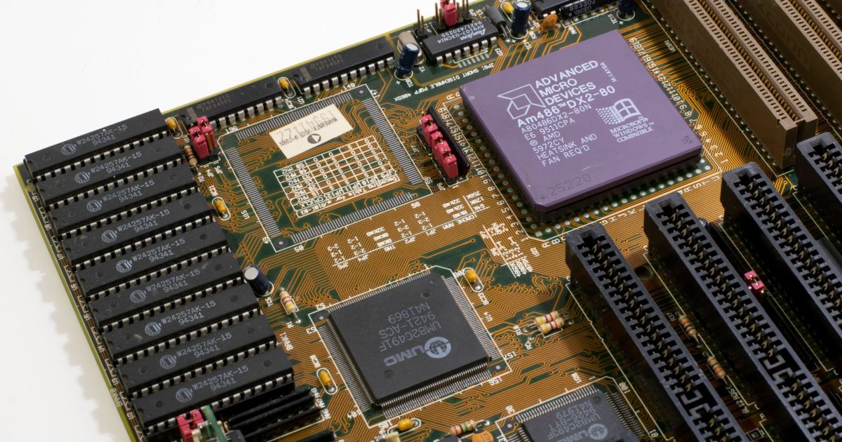 Detailed close-up image of a vintage motherboard showcasing microprocessor and components.