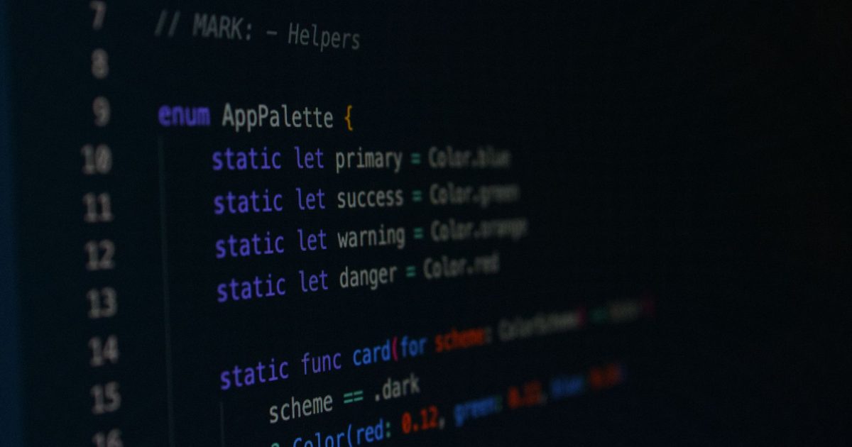 Macro photography of color palette code in a programming environment.
