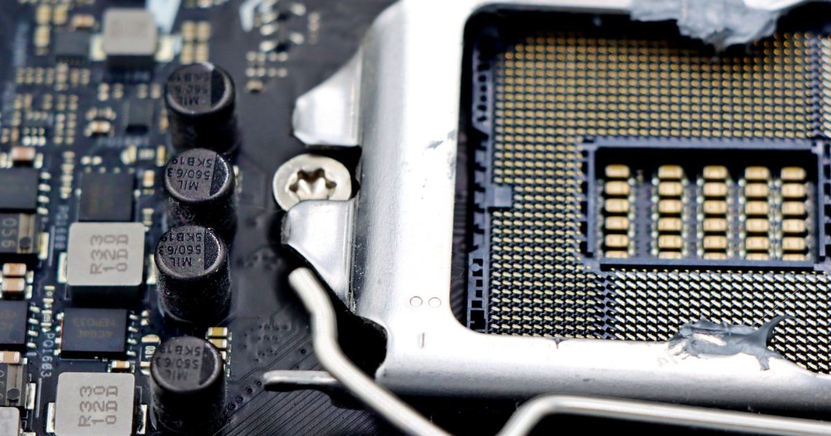 Detailed close-up image of a CPU socket and components on a motherboard.