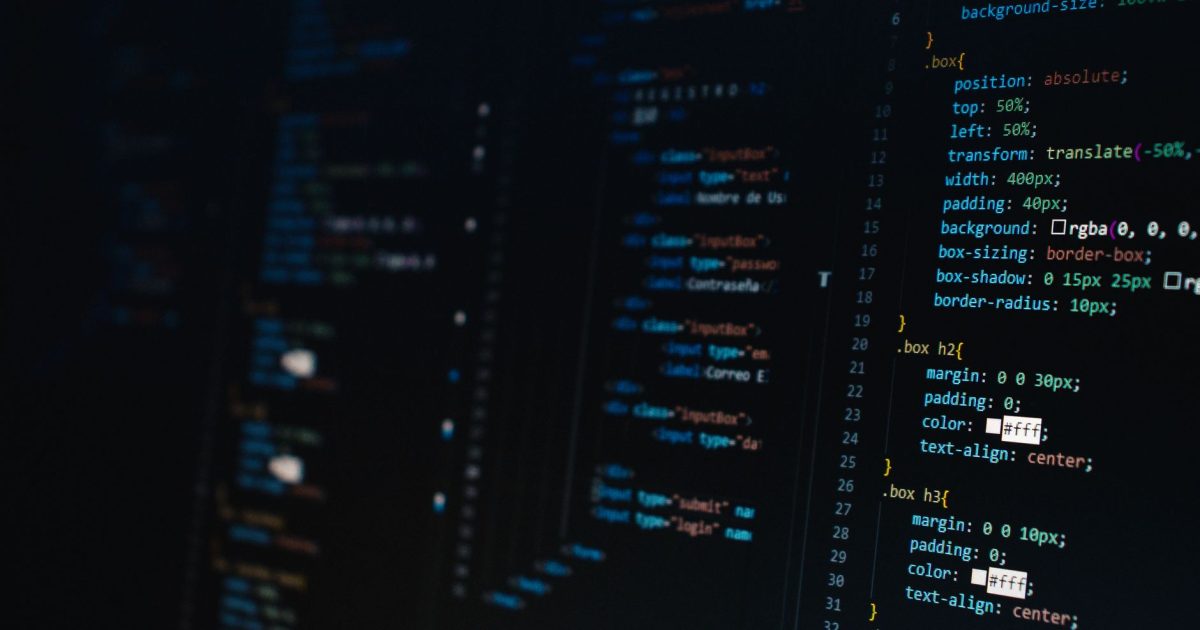 Detailed view of HTML and CSS code on a dark screen, representing modern web development.